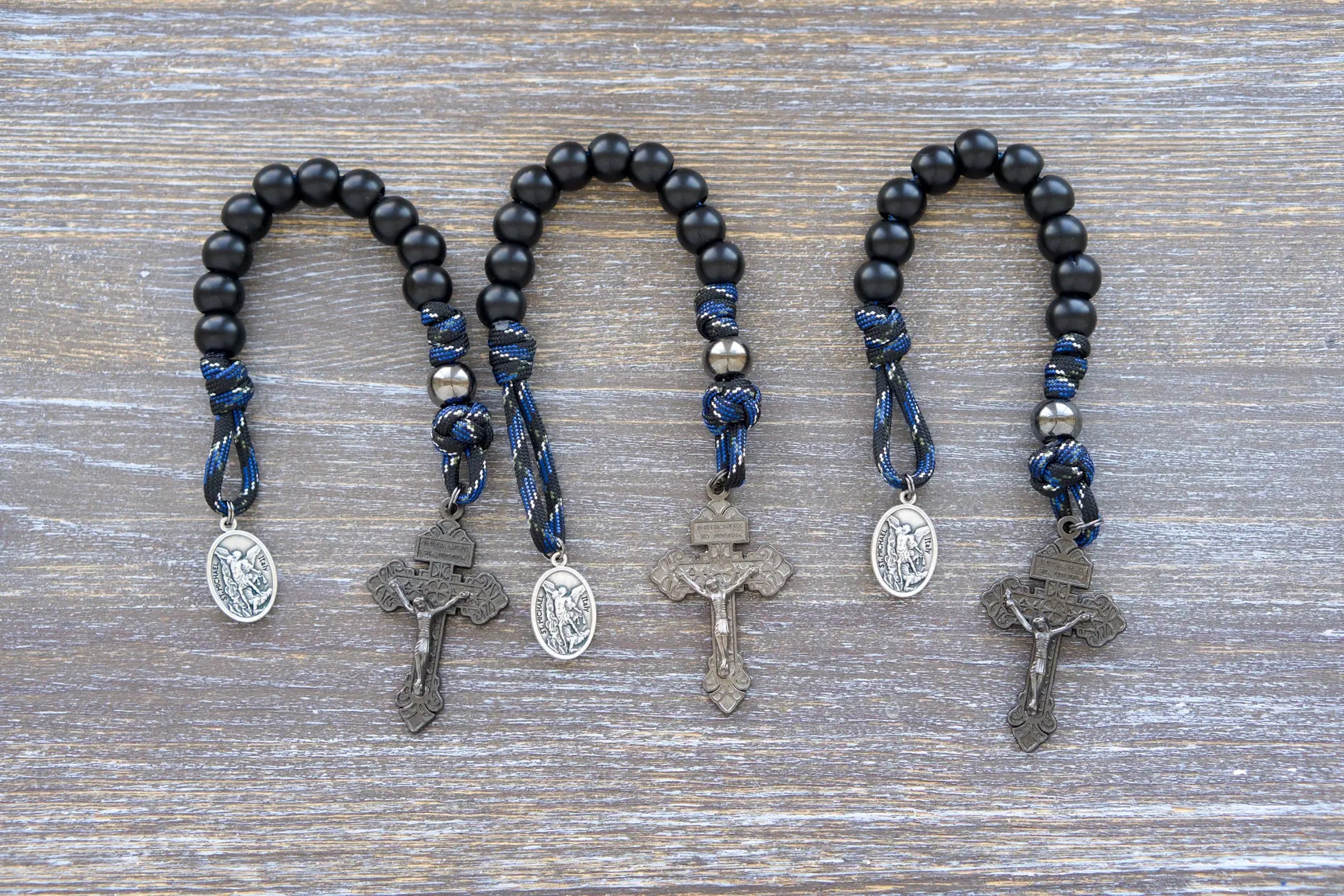 Thin Blue Line Pocket Paracord Rosary: gunmetal & matte black beads, camo paracord, St. Michael medal, and gunmetal crucifix.
