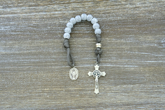 Tower of Ivory - Pocket Paracord Rosary: Exquisite, long-lasting 1 decade rosary with dark grey rope, silver Our Father beads, and unique cracked ivory-looking Hail Mary beads. Featuring a 2-inch St. Benedict crucifix and Miraculous Medal, this premium unbreakable paracord rosary is perfect for adult Catholics.