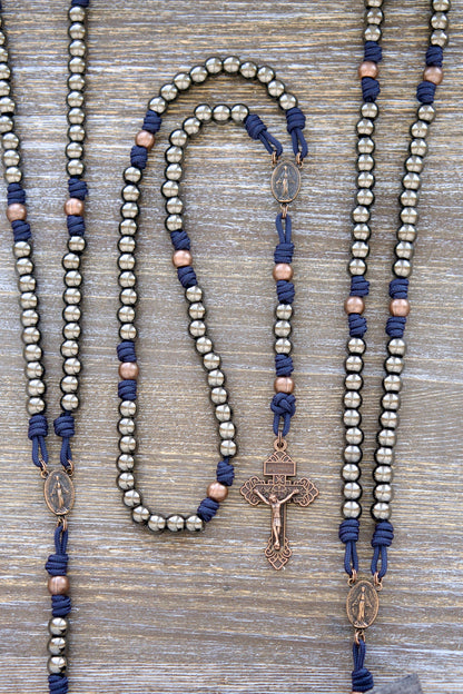 Unbreakable Fidelity Premium Metal Paracord Rosary - Handmade Navy Blue paracord with 10mm gunmetal Hail Mary beads, antique copper Our Father beads, copper Miraculous Medal centerpiece, and a copper Pardon Crucifix.