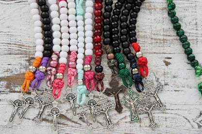 Our artisans handcraft each custom 1 decade paracord rosary with care, making it perfect for your personal style and faith. Choose from a variety of colors and materials to create a one-of-a-kind piece that reflects your unique Catholic journey. Make an impact with this durable, premium quality rosary designed specifically with kids in mind.