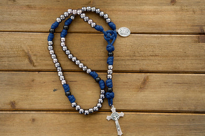 Discover the power of prayer with our Kids Blue and Gunmetal - 5 Decade Paracord Rosary. This durable, premium unbreakable paracord rosary is designed specifically for boys, featuring blue rope and gunmetal beads.