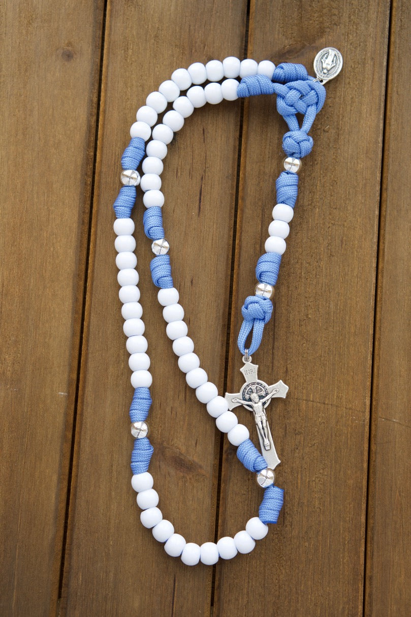 Kid's light blue paracord rosary with white Hail Mary beads, silver Our Father beads, and a 2" St. Benedict crucifix - perfect for First Communion or Easter gifts