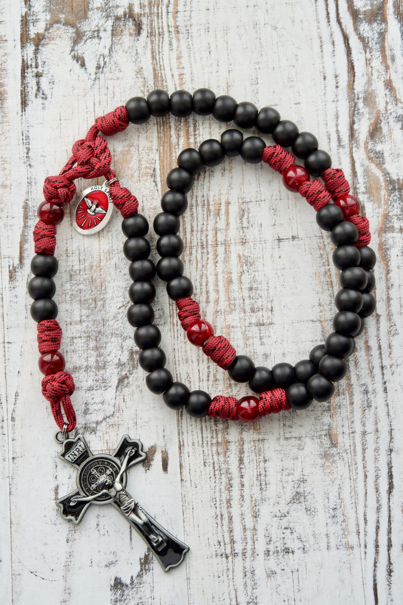 The Crimson Shield - Holy Spirit Confirmation 5 Decade Paracord Rosary with dark maroon beads, matte black Hail Mary beads, and a powerful 3" St. Benedict crucifix. Durable, unbreakable paracord rosary for boys or men preparing for Confirmation.