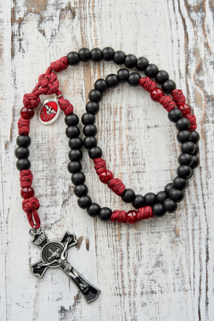 The Crimson Shield - Holy Spirit Confirmation 5 Decade Paracord Rosary with dark maroon beads, matte black Hail Mary beads, and a powerful 3" St. Benedict crucifix. Durable, unbreakable paracord rosary for boys or men preparing for Confirmation.
