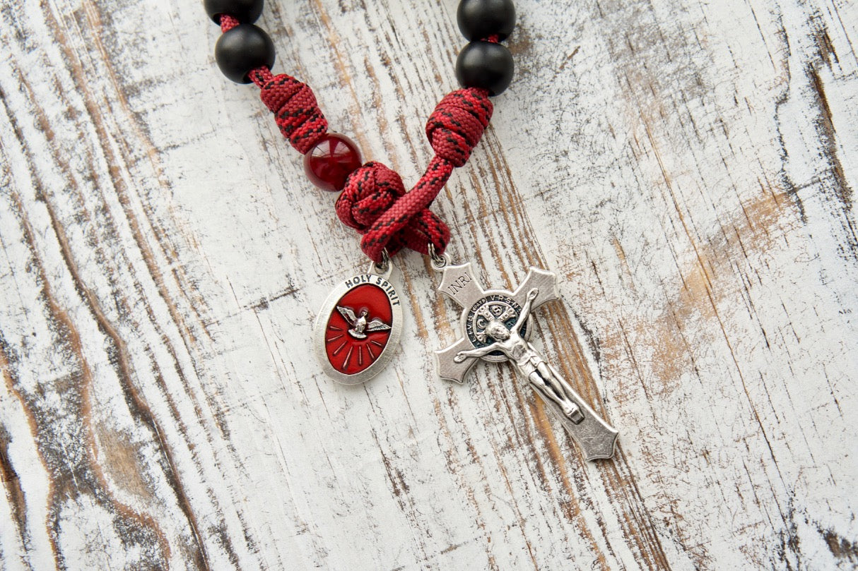 The Crimson Shield - Holy Spirit Confirmation 1 Decade Paracord Rosary. A powerful, durable paracord rosary designed for boys or men preparing to receive the Sacrament of Confirmation. This spiritual weapon features sturdy 550 maroon red paracord, dark maroon Our Father beads, and matte black Hail Mary beads.
