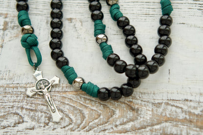 Dark Night of the Soul - 5 Decade Paracord Rosary: Durable, premium, and unbreakable paracord rosary featuring dark green rope, black and gunmetal beads, St. Michael and Guardian Angel devotional medal, and St. Benedict Crucifix. Perfect for younger Catholics seeking strength in times of darkness.
