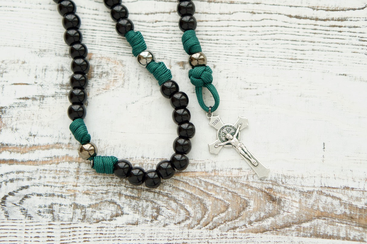 Dark Night of the Soul - 5 Decade Paracord Rosary, featuring durable dark green rope, black and gunmetal beads, St. Michael and Guardian Angel devotional medal, St. Benedict Crucifix, perfect for prayer during life's challenges and spiritual battles.