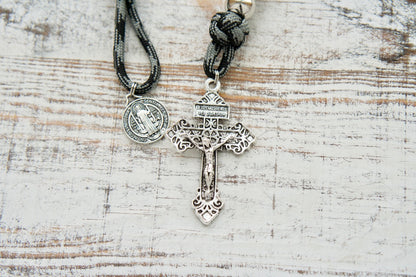 The Demon Destroyer - 1 Decade Paracord Rosary, featuring a sleek black and silver design, durable paracord, silver Pardon Crucifix, St. Benedict Medal, and perfect for daily spiritual nourishment against life's obstacles.