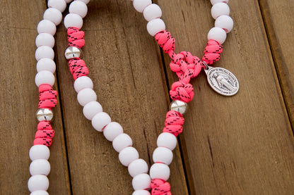 The Family Protector - Pink and White 5 Decade Paracord Rosary with Miraculous Medal, perfect for girls, daughters, moms, and wives. Strong and durable design, handmade by a small Catholic family, guaranteed not to break.