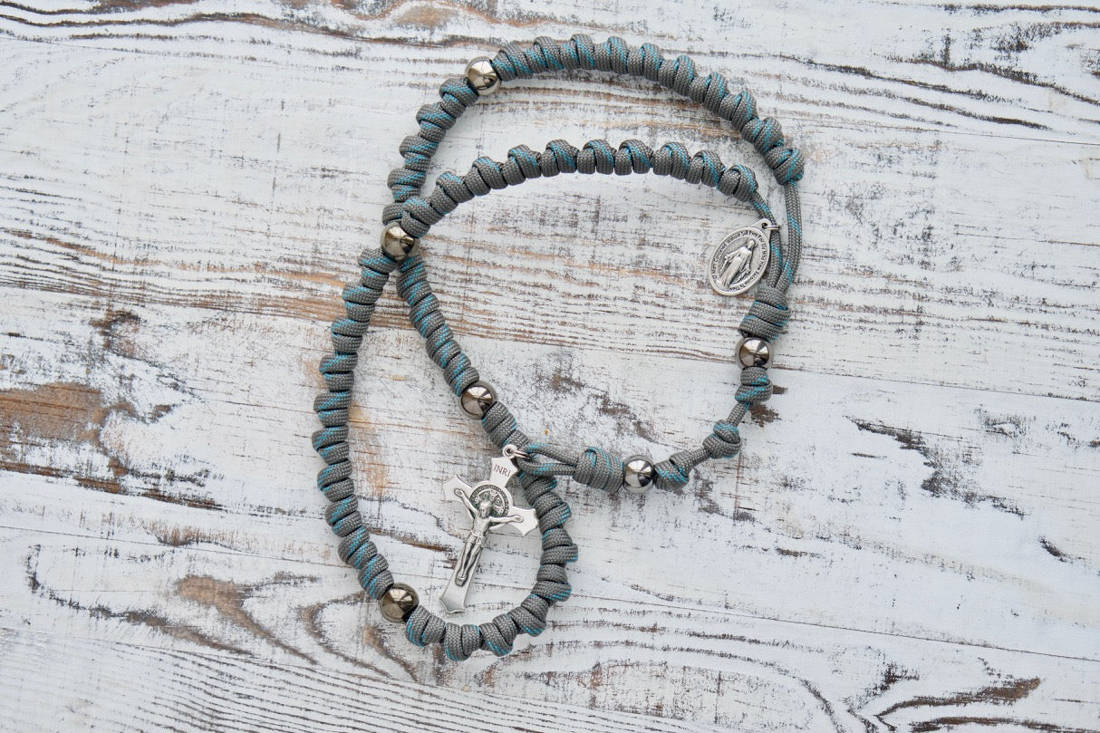 Heaven's Embrace - Grey, Teal Blue, Gunmetal - Knotted Rope Rosary: Experience the unbreakable spiritual protection with this full-size paracord rosary. Featuring a sturdy Paracord 550 rope design and premium acrylic beads, this Catholic gift is perfect for any spiritual journey. 