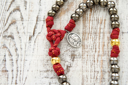 The Holy Family - 5 Decade Paracord Rosary: Durable, premium unbreakable paracord rosary with royal red, gold, and gunmetal Holy Family design; features a 3" gold crucifix and double-sided Holy Family/St. Joseph medal; perfect for prayer and daily battles.