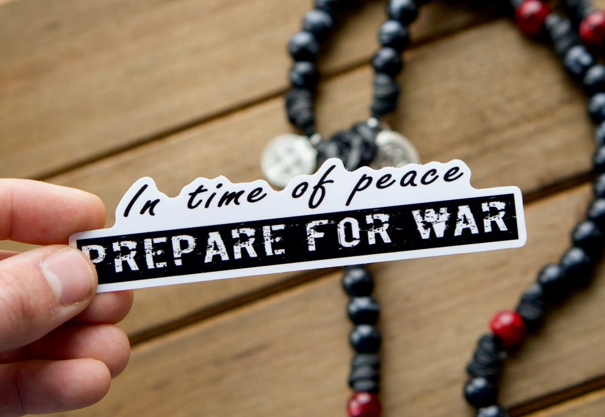 In time of Peace, Prepare for War - Vinyl Sticker: A powerful reminder to never grow complacent in the face of evil. Pair this waterproof, dishwasher-safe, and microwave-resistant sticker with a strong rosary from Sanctus Servo to spread the faith and always be ready!