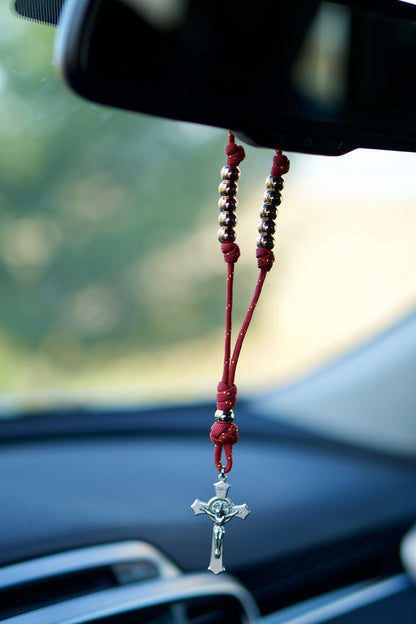 Embrace the power of prayer on-the-go with our Maroon and Rose Gold Rearview Mirror Paracord Rosary. This premium unbreakable paracord rosary is designed to fit around your rearview mirror, ensuring protection for you and your passengers while traveling!
