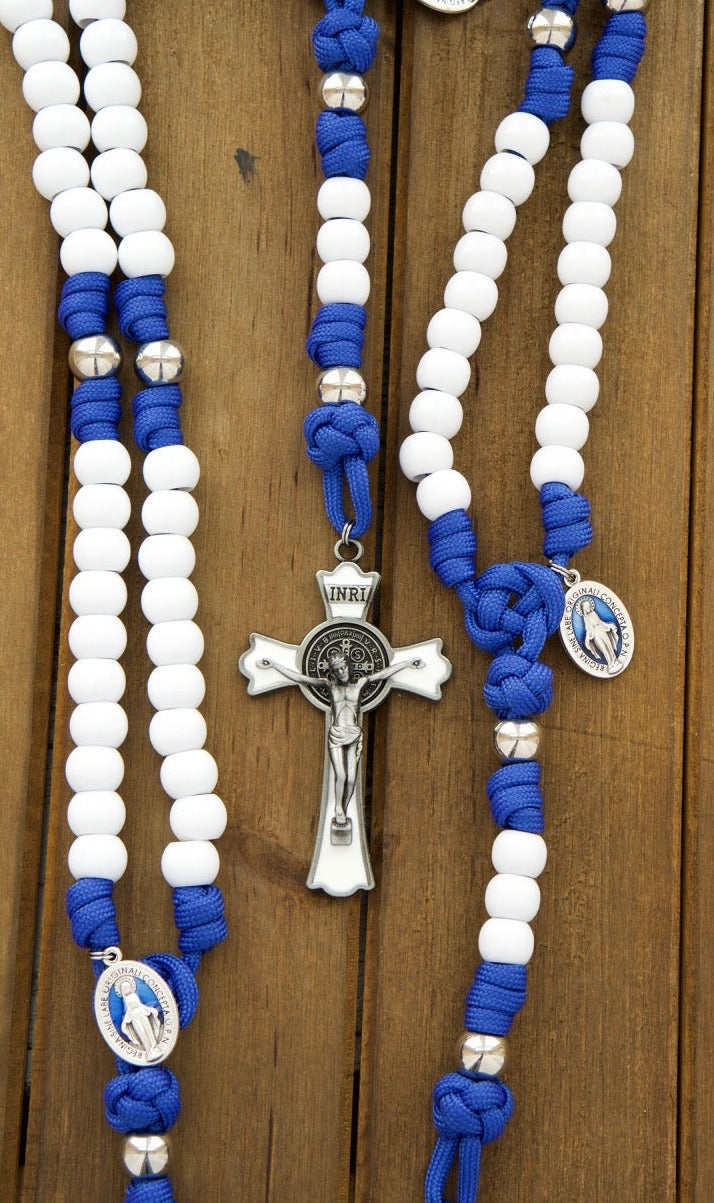 Our Lady of Miraculous Medal - 5 Decade Paracord Rosary with blue rope, white Hail Mary beads, shiny silver Our Father beads, and a large 2.75" White Enamel St. Benedict Crucifix. Durable, unbreakable Catholic gift for prayer warriors.