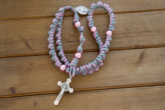 Pink and Green - Knotted Paracord Rope Rosary: A durable, premium paracord rosary for Catholic women, featuring a snakeskin patterned rope with pink Our Father beads, St. Benedict Crucifix, and Miraculous Medal. Perfect for spiritual battles, comfortably fits in hand or pocket.