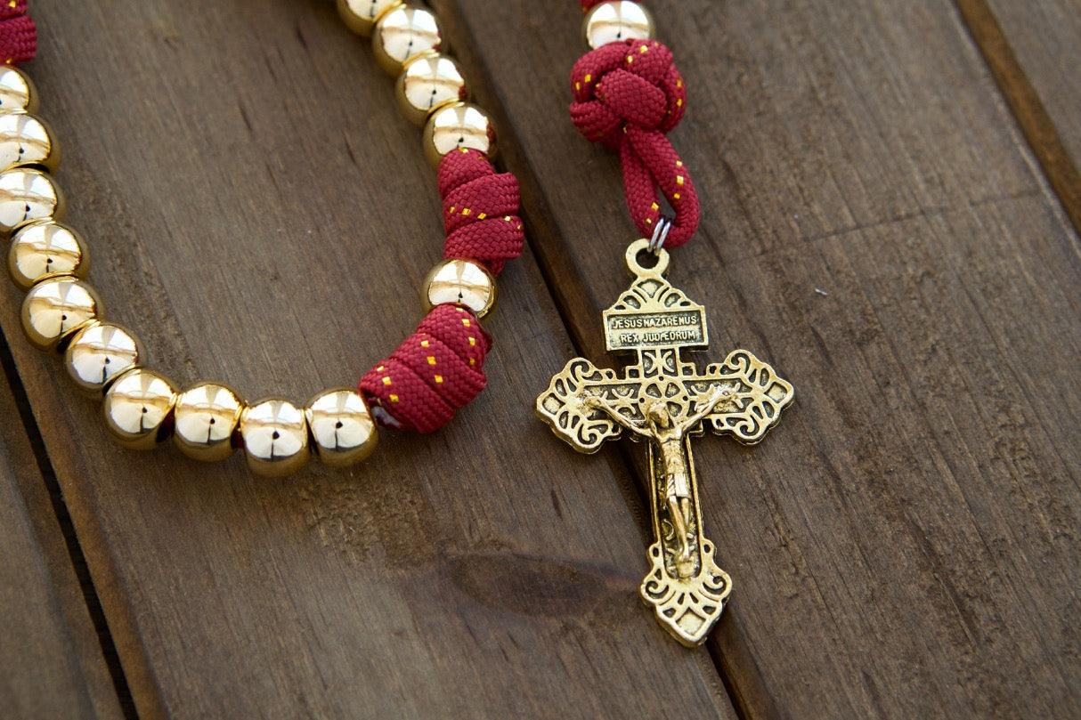 Scarlet Crown - Royal Red and Gold Paracord Rosary with 10mm Gold Beads, Subtle Gold Ribbon in Red Paracord, Gold Hail Mary and Our Father Beads, 2" Gold Pardon Crucifix, and Miraculous Medal for Devout Catholics.