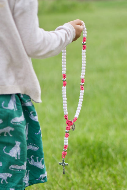 Pink and White 5 Decade Paracord Family Protector Rosary, featuring white Hail Mary beads, silver Our Father beads, Miraculous Medal, and a powerful prayer accessory for girls, daughters, moms, and wives, guaranteed not to break.