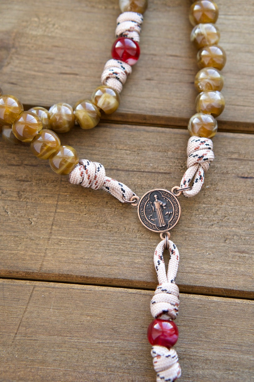 The Heavenly Rose - Maroon, Brown and Copper - 5 Decade Paracord Rosary, featuring a durable camo rope, elegant maroon and brown beads, St. Benedict medal centerpiece, and an antique copper Pardon Crucifix for unbreakable spiritual strength in your faith journey.