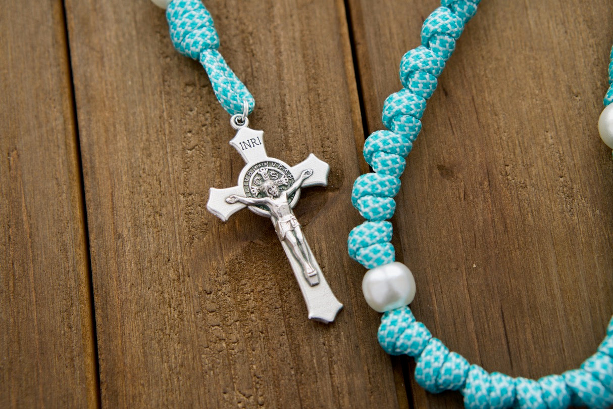 The Peaceful Waters - Teal Blue and White Knotted Rope Rosary: Durable Paracord 550 rosary with white pearl beads, St. Benedict Crucifix, and Miraculous Medal for prayerful protection and companionship.
