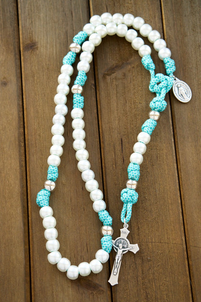 The Peaceful Waters - White, Silver, and Teal Blue - 5 Decade Rosary: A stylish, durable, and comfortable rosary for modern Catholic women featuring teal blue paracord, pearl Hail Mary beads, silver Our Father beads, St. Benedict Crucifix, and Miraculous Medal, perfect for everyday prayer and spiritual battles.